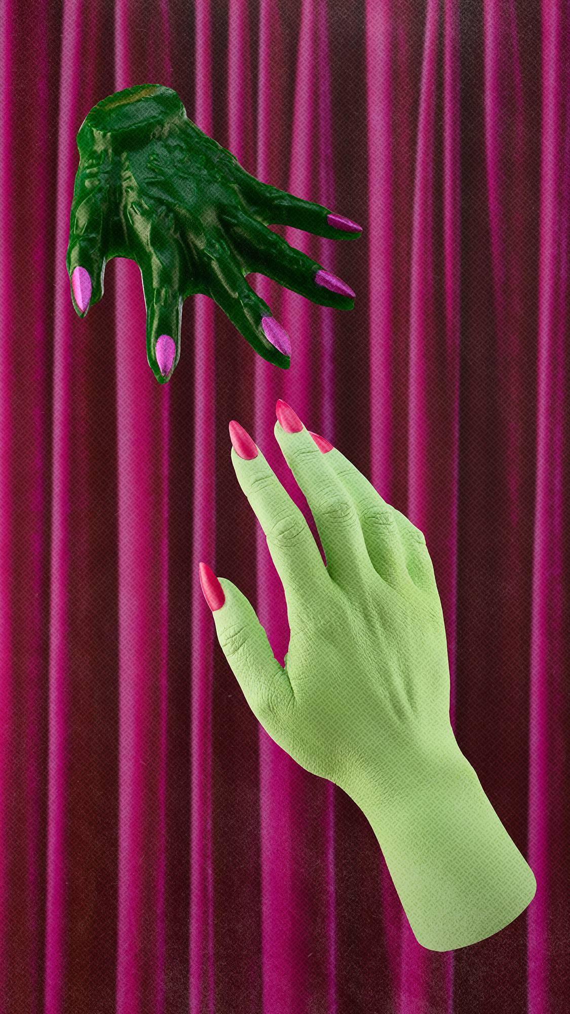 A pale green witch's hand reaches upwards towards a smaller, textured dark green shower gummy shaped like a hand with metallic pink nails. The scene is set against a background of pleated, deep pink velvet curtains.