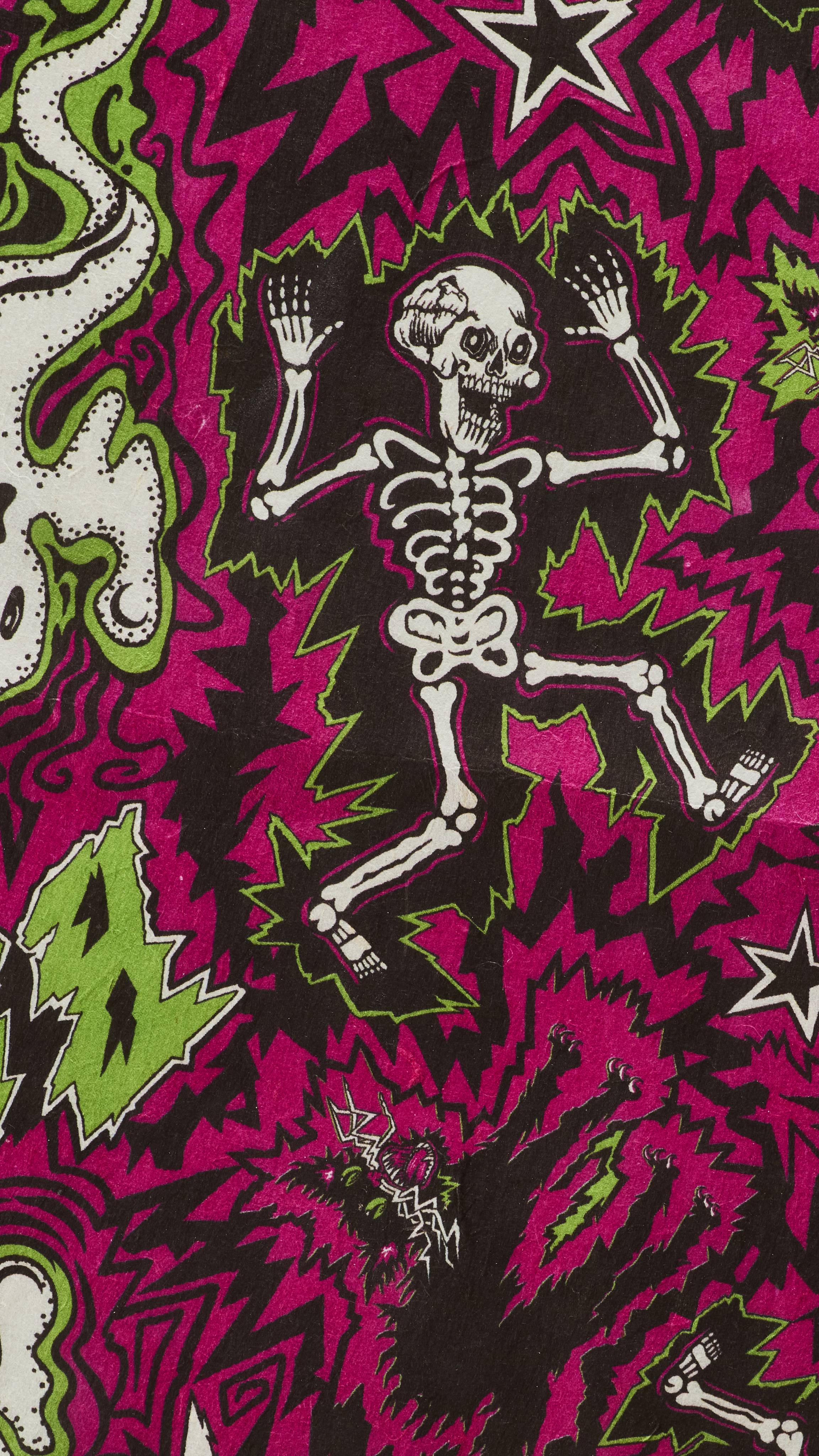 A close-up of Lush "Screech" Lokta wrapping paper with a busy, jagged pink and black background. It features a comic-style Halloween illustration of a dancing white skeleton surrounded by green electric shocks, alongside a startled black cat.