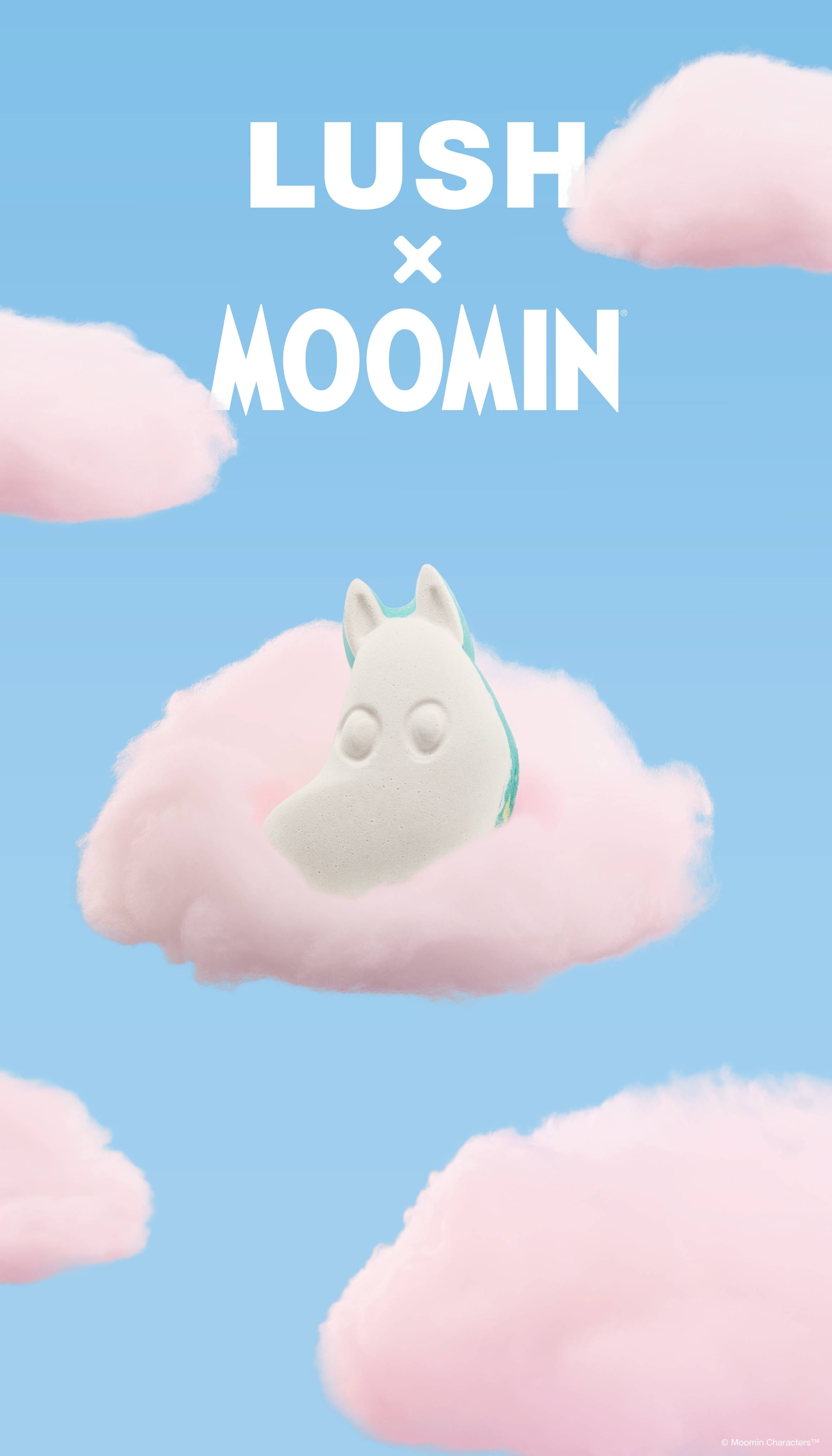 A promotional graphic featuring a white Moomintroll bath bomb resting on a fluffy pink cloud. The sky-blue background is filled with scattered pink clouds below bold white text reading "LUSH x MOOMIN".