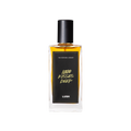 A glass perfume bottle filled with amber liquid. A black label reads 'The Perfume Library' and '1000 Kisses Deep'.