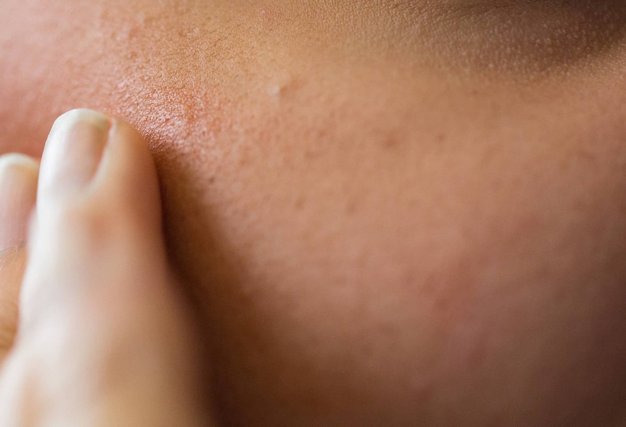 Charisma, a slightly shimmery, rosy-bronze skin tint, is lightly applied to the skin with an index finger.