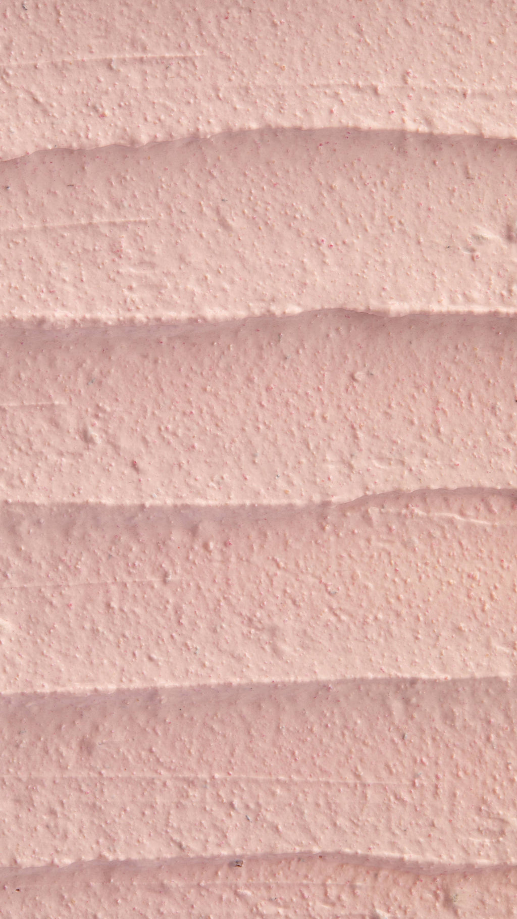 A super close-up image of the creamy, thick Mrs Whippy face mask product, focusing on the thick consistency of the flecks of finely blended fresh raspberries.
