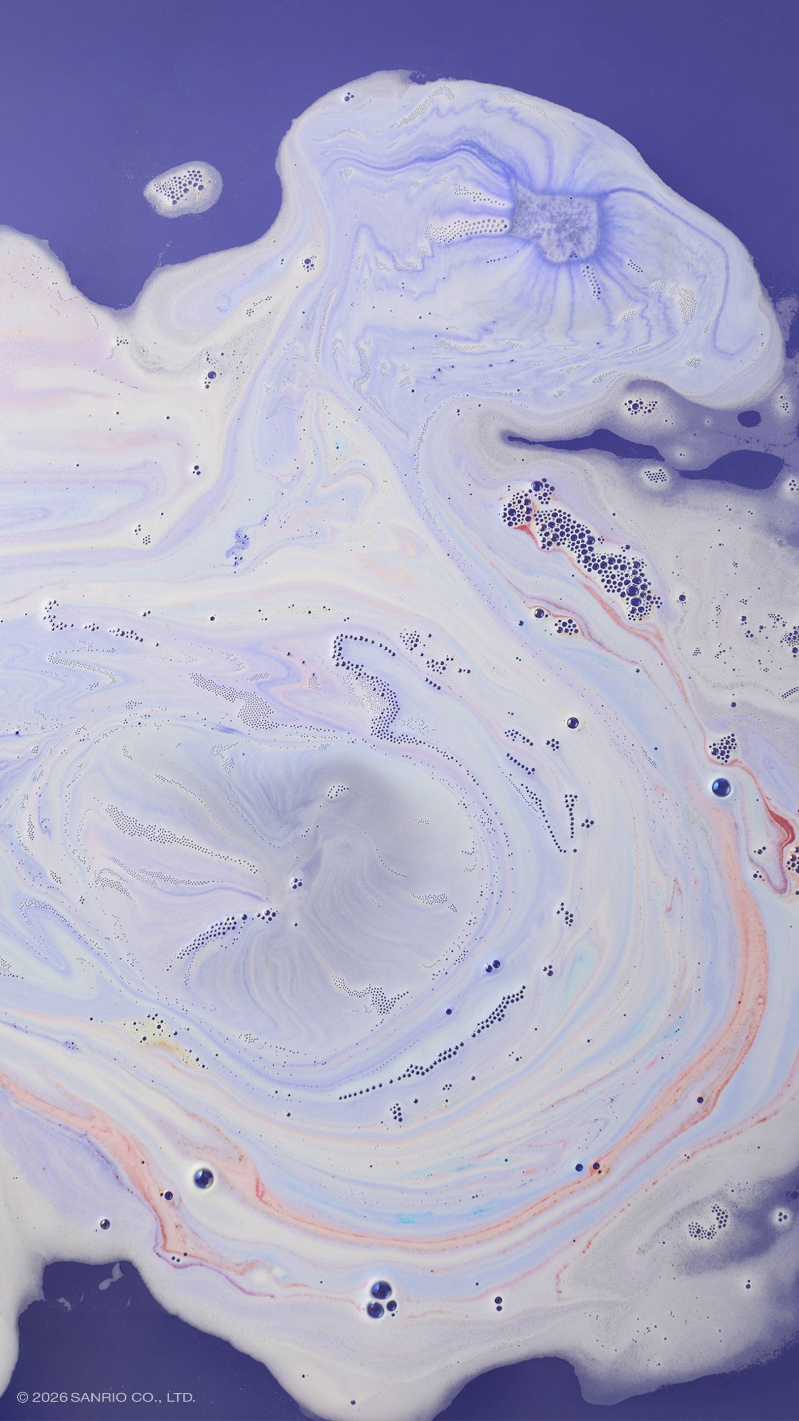 An overhead shot of vibrant purple bath water covered in swirling patterns of thick, creamy white foam. Marbled streaks of pastel pink, blue, and lilac weave through the bubbles, creating a dreamlike, textured marble effect on the surface.