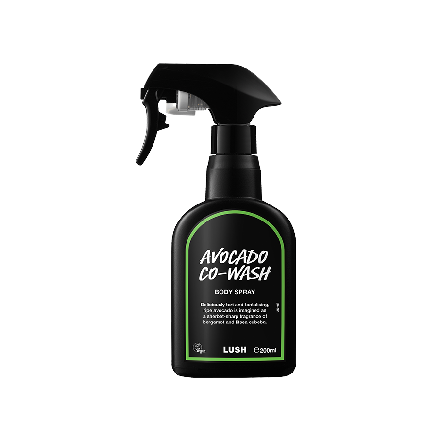 Avocado Co-Wash. A black spray bottle of Lush Avocado Co-Wash Body Spray. The product label is black with a lime green banded border. White text states the product name and the scent description.