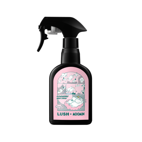A black plastic trigger spray bottle of Lush "Cloudberry Body Spray". The pink front label features comic strip illustrations of Moomin characters and bold text reading "LUSH x MOOMIN".