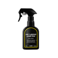 Dad's Garden Lemon Tree body spray. A black spray bottle of Lush "Dad's Garden Lemon Tree" Body Spray. The product label is black with a vibrant, dandelion-yellow banded border. White text states the product name and the scent description.