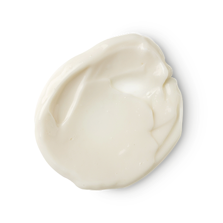 Karma Kream. A smooth, circular dollop of creamy, off-white Lush skincare product, showing soft ridges and a rich, glossy texture.