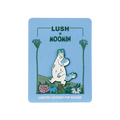 A 'Lush x Moomin' limited edition pin badge on a light blue backing card. The enamel pin depicts Moomintroll walking through colourful flowers with blue soap suds on his nose, head, and tail.