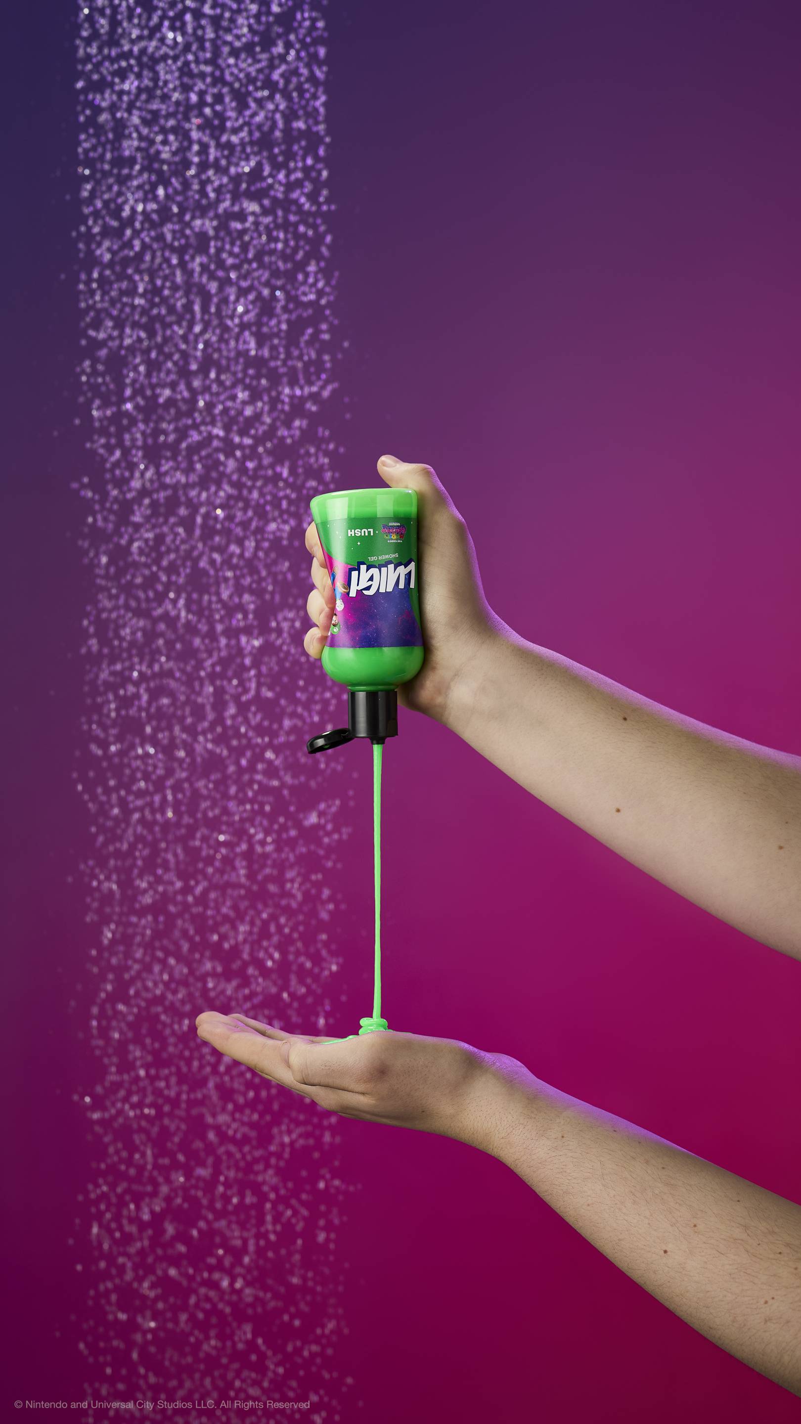 Vibrant green gel pours from a Luigi shower gel bottle into an open hand under a shower spray. Set against a purple-magenta gradient background.