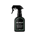 Mr Wallet body spray. A black spray bottle of Lush "Mr Wallet" Body Spray. The product label is black with a mint-green banded border. White text states the product name and the scent description.