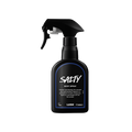 Salty body spray. A black spray bottle of Lush "Salty" Body Spray. The product label is black with a navy blue banded border. White text states the product name and the scent description.