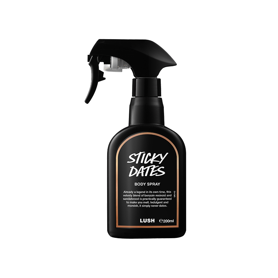 Sticky Dates body spray. A black spray bottle of Lush "Sticky Dates" Body Spray. The product label is black with a light brown banded border. White text states the product name and the scent description.