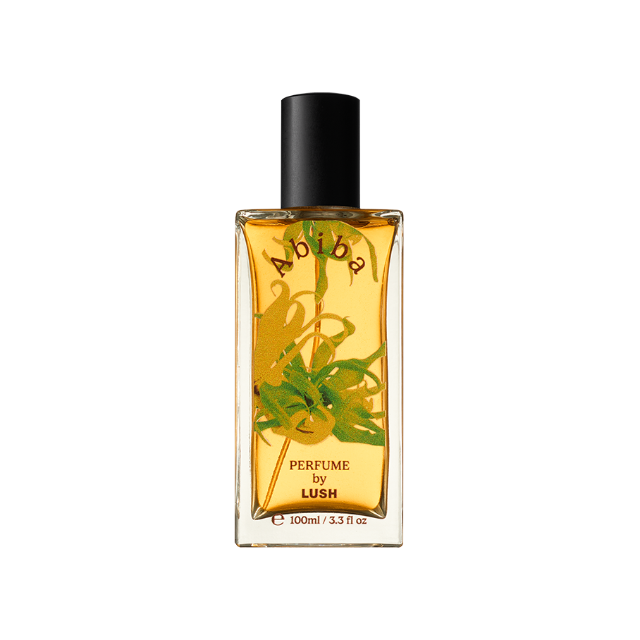 Abiba. A rectangular, glass perfume bottle with a black cap is filled with translucent, almost-yellow liquid. The name "Abiba" is arched on the front of the bottle along with flower decals.