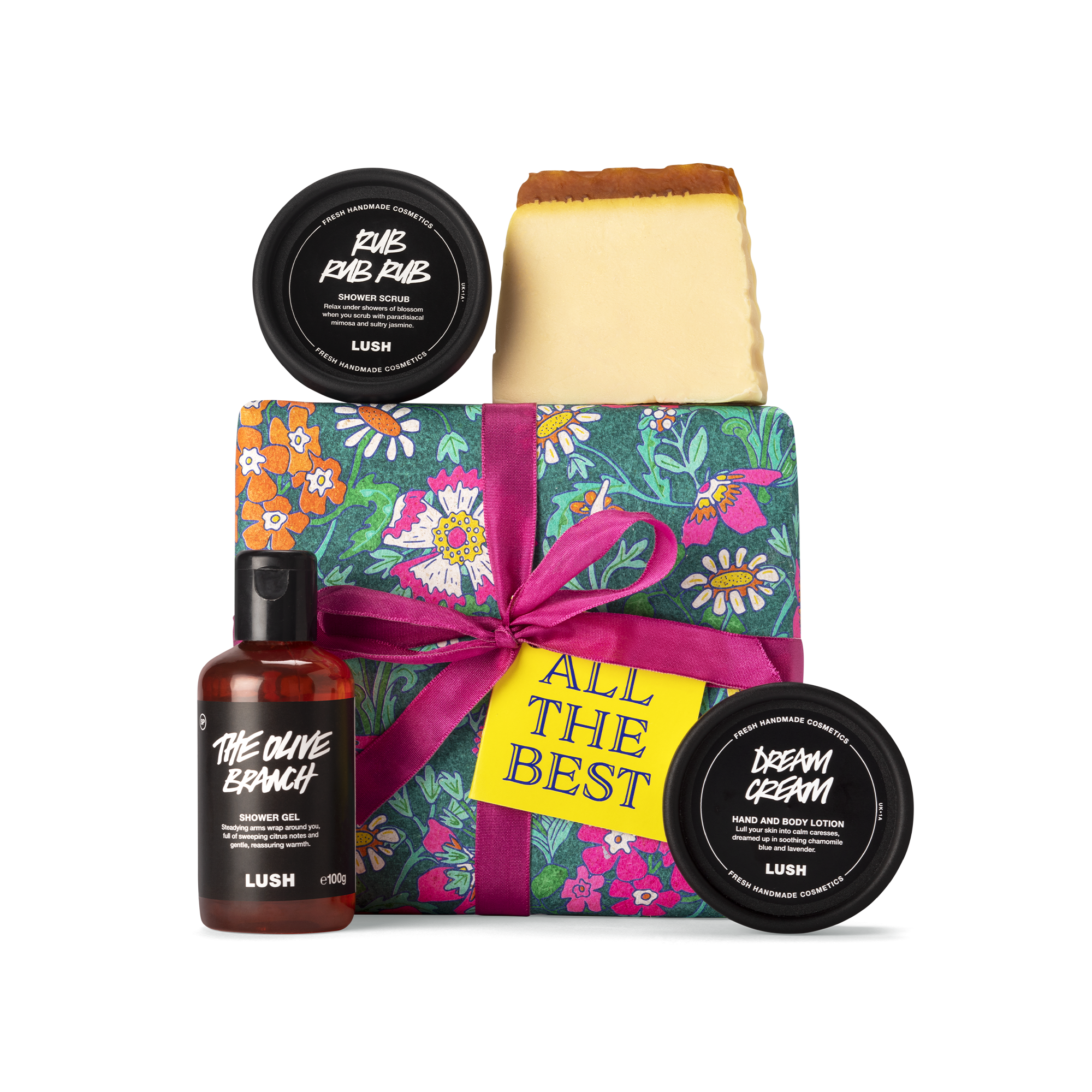 All the Best. A square box, wrapped in green, floral printed banana paper, tied with pink ribbon and a yellow gift tag.