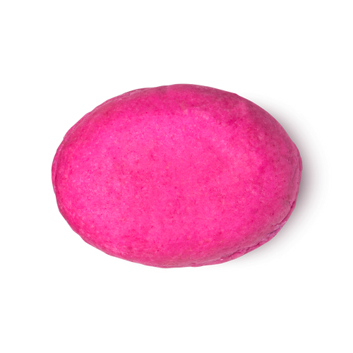 American Cream. A fuchsia pink, oval shaped solid conditioner bar.