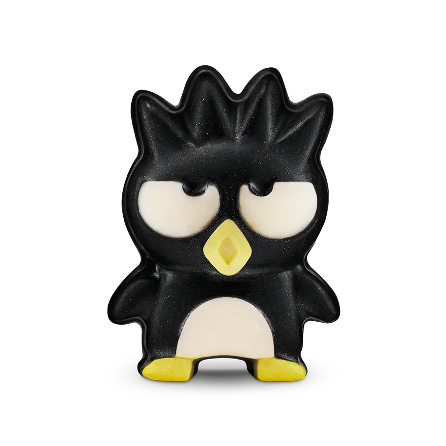 Bad Badtz-Maru. A soap shaped like a penguin character with spiky hair, a grumpy expression, and a yellow beak and feet. The character has a cream-coloured belly and large, half-lidded eyes.