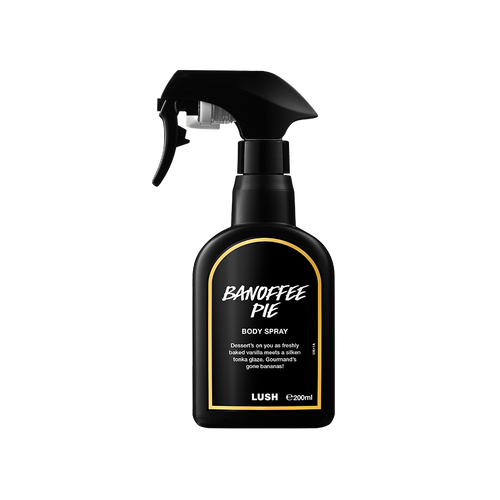 A black spray bottle of Lush 'Banoffee Pie' body spray. The label features white text with a yellow border. The bottle has a trigger spray nozzle and contains 200ml of product.