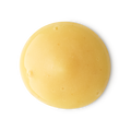 A smooth, circular dollop of creamy yellow shower gel with a glossy finish. The thick, opaque liquid features tiny air bubbles and is centered against a clean, neutral grey background.