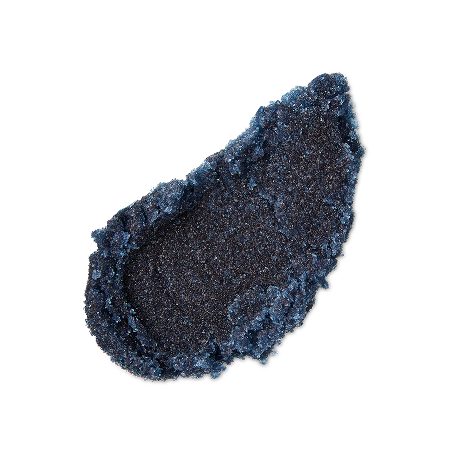 Blackcurrant and Mint. A neatly smeared swatch of thick, textured dark blue lip scrub. The product is heavily textured with sugar granules.