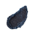 Blackcurrant and Mint. A neatly smeared swatch of thick, textured dark blue lip scrub. The product is heavily textured with sugar granules.
