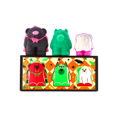 Boo Bears gift. Three monster bear bath bombs sit atop an orange chequered box featuring illustrations of themselves. Left to right: a black vampire bear, a green three-eyed monster bear, and a white ghost bear with bright pink feet.