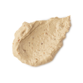 Bring Us Some Figgy Pudding. A neatly smudged swatch of thick, creamy, textured face mask. There are flecks of finely ground dried figs throughout the product.