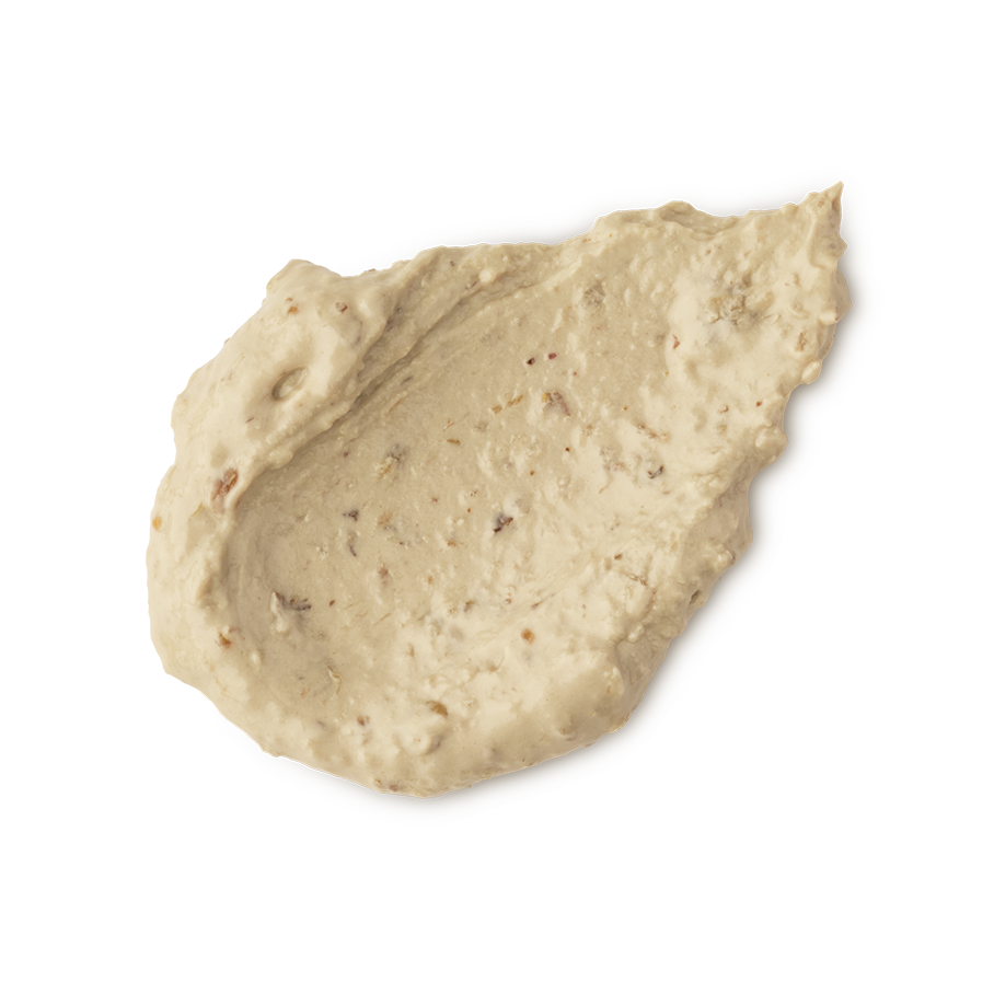 Bring Us Some Figgy Pudding. A neatly smudged swatch of thick, creamy, textured face mask. There are flecks of finely ground dried figs throughout the product.