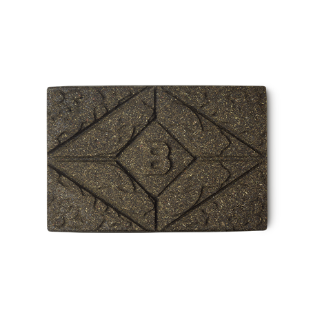 Brun Henna. A brown rectangular block of solid henna hair colour, with a floral design and the letter B pressed on the top.