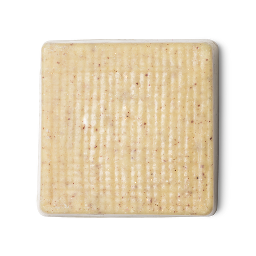 Buffy. A cream coloured, rounded square shaped, solid body butter, flecked with ground rice, almonds and aduki beans.