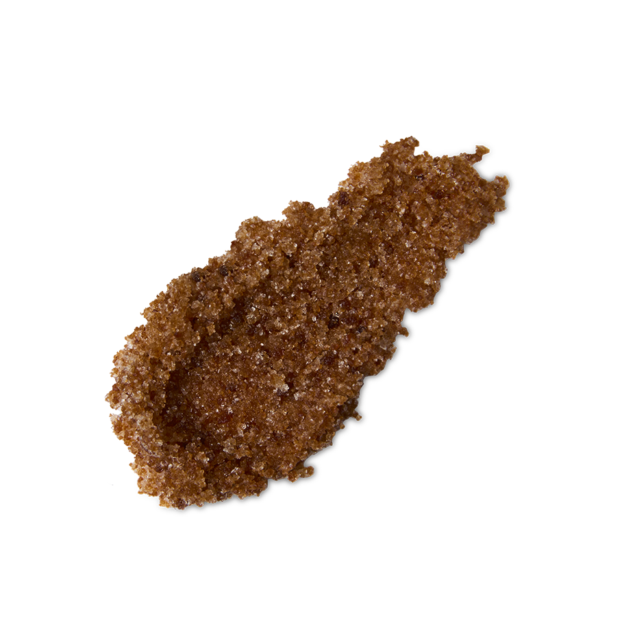Buzz. A neatly smeared swatch of thick, textured, deep caramel-coloured lip scrub with visible sugar granules.