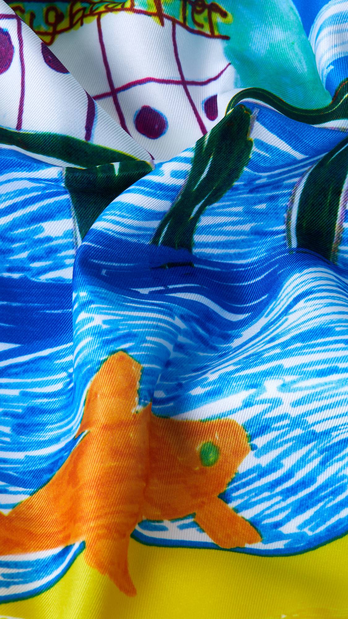 A super close-up image of the By The Seaside knot wrap with the lighting focusing on the texture of the material and the vibrant colours.
