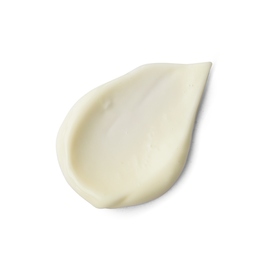 A close-up product swatch of a thick, teardrop-shaped dollop of Calm primer. The product has a creamy, smooth texture and a pale, yellowish-ivory color,