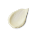 A close-up product swatch of a thick, teardrop-shaped dollop of Calm primer. The product has a creamy, smooth texture and a pale, yellowish-ivory color,