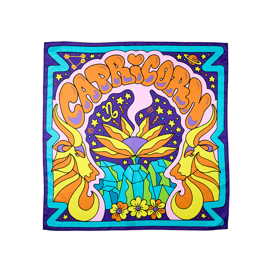 Capricorn. A vibrant, square, fabric knot wrap. It is designed with a purple and blue border. The word "Capricorn" is arched in orange across the centre in bubble letters with a retro, groovy, mountain scene with a goat face profile on either side.
