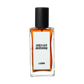 Chelsea Morning. A rectangular, glass perfume bottle with a black cap is filled with amber liquid. A white label reads 'Chelsea Morning'.