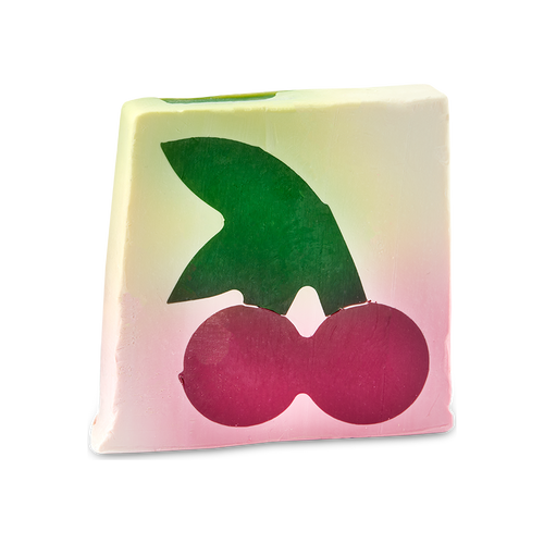 Cherry On Top. An off-square slice of cream-coloured soap which features a cross-section design of a large dark pink cherry with a large green leaf.