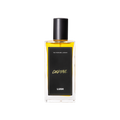 A glass perfume bottle filled with light amber liquid. A black label reads 'The Perfume Library' and 'Cocktail'.