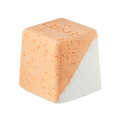 Cold Water Soother. A rounded, cube-shaped bath bomb with a lower diagonal half of crisp white and the top is a peachy-orange colour. There are visible flecks of Epsom salt throughout.