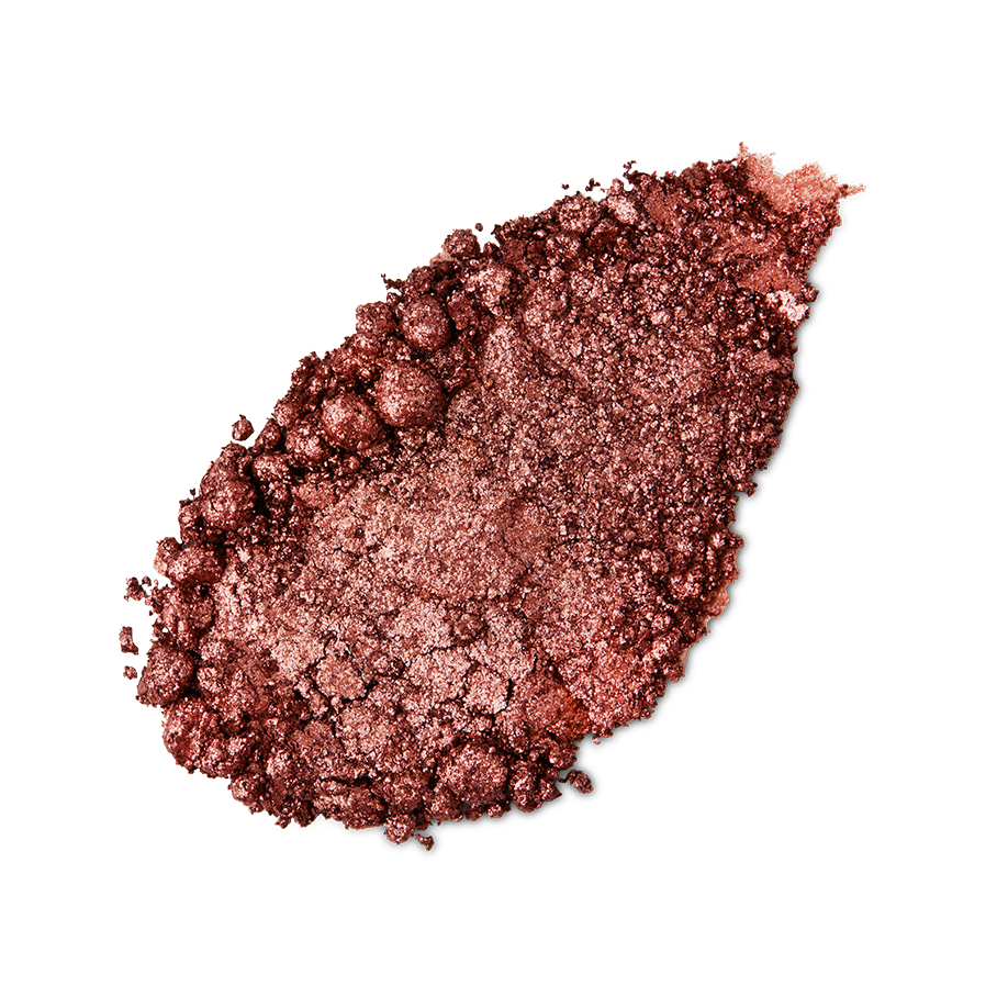 Comet Glitter Crumble. A neatly smudged swatch of crumbly, shimmering, earthy-bronze, metallic eyeshadow.