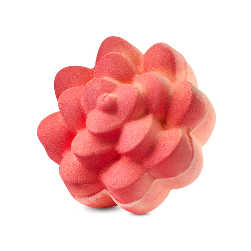 Comforter Rose. A vibrant coral-coloured bath bomb sculpted into the shape of a blooming rose with thick, rounded petals. The textured surface has a matte finish with subtle peach-coloured highlights.