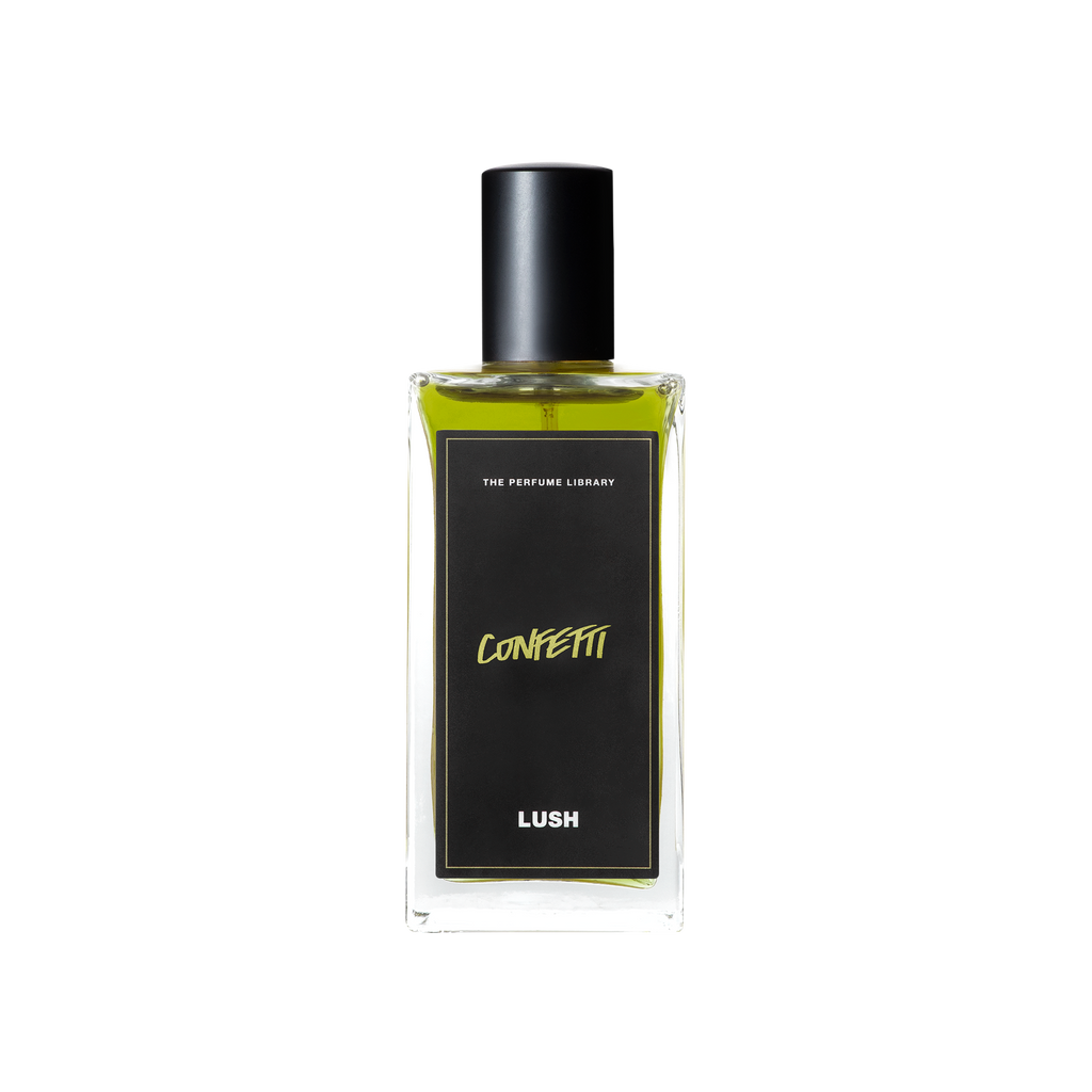 A glass perfume bottle filled with lime green liquid. A black label reads 'The Perfume Library' and 'Confetti'.