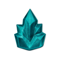 Cooling shower gummy. A shimmering teal-blue shower gummy is sculpted into a faceted, geometric crystal cluster shape. The angular structure has sharp lines and a glittering finish that catches the light.