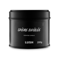 Crème Brûlée. A round, black, candle tin with a removable lid. The black label on the front reads "Crème Brûlée Scented Candle" in white text.