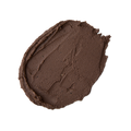 Cupcake. A neatly smeared swatch of thick, dark brown clay-like face mask with a matte, textured finish.