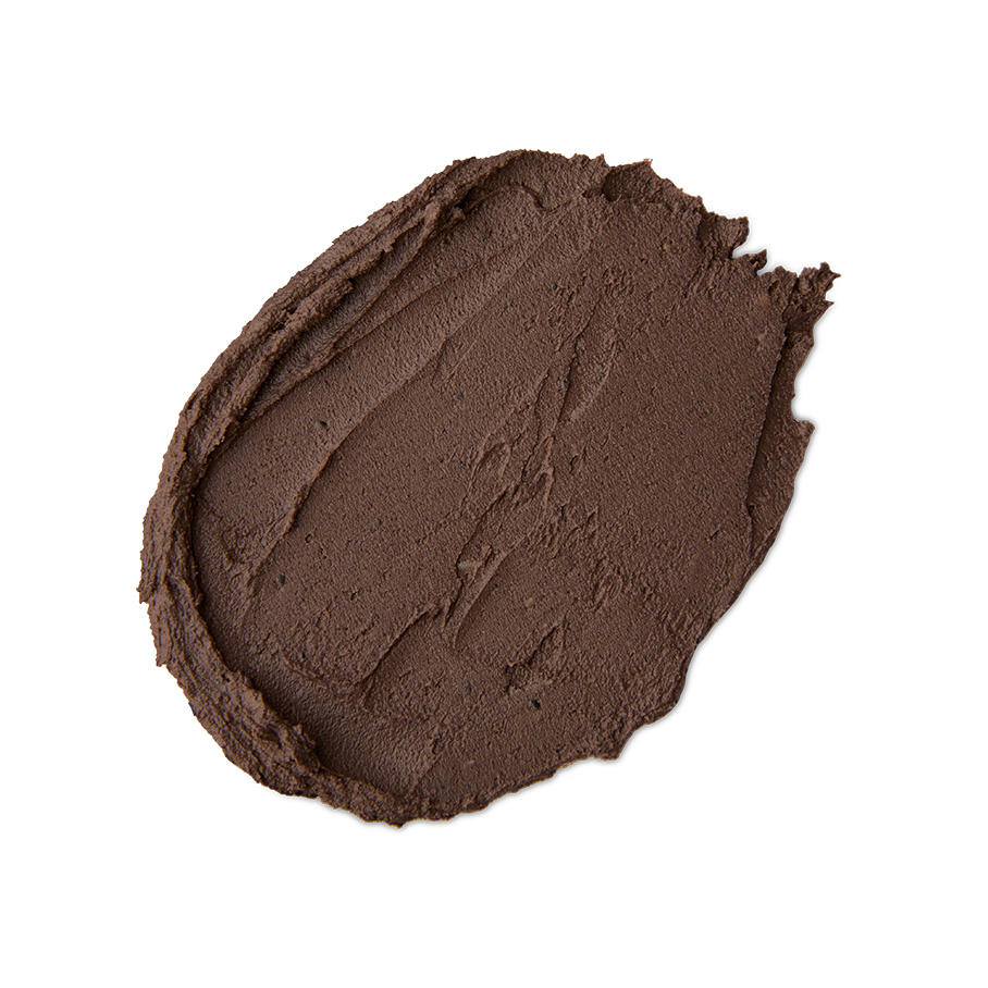 Cupcake. A neatly smeared swatch of thick, dark brown clay-like face mask with a matte, textured finish.