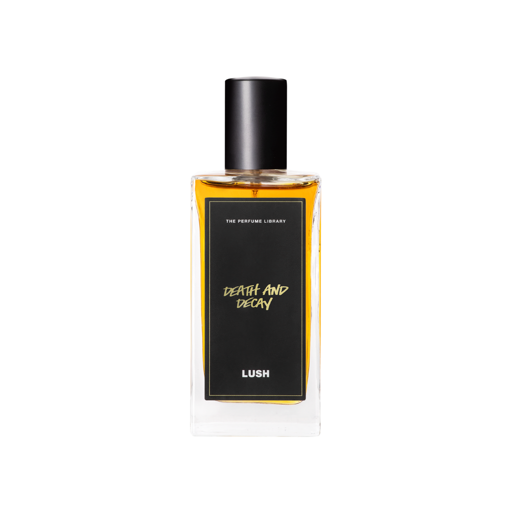 A glass perfume bottle filled with dark amber liquid. A black label reads 'The Perfume Library' and 'Death and Decay'.