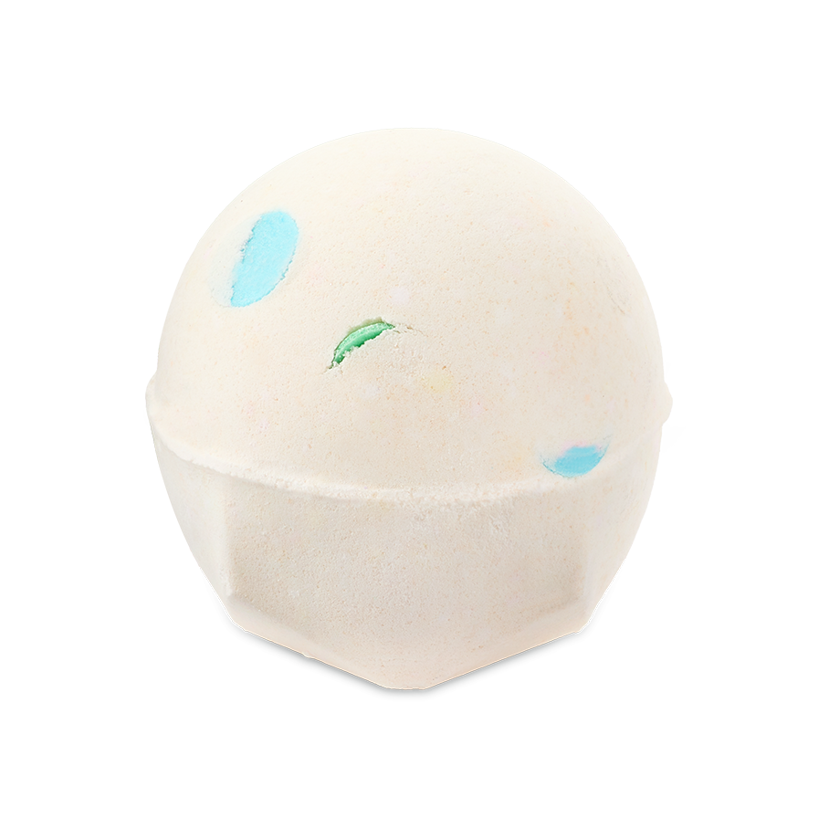 Dragon's Egg. A spherical, pale off-white bath bomb with a flat, geometric base. It has small, colourful spots of blue and green peeking through the surface.