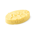 Each Peach (And Two's A Pair). A buttery yellow, oval shaped, solid massage bar, with an embossed orange fruit flower design.