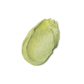 A swatch of thick, slightly textured, light green coloured Glory conditioner.