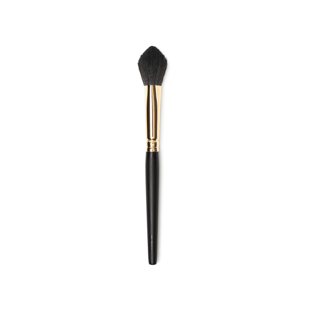 Glow To Town Brush. A flame shaped, blending/powder brush. Tapered, fluffy brown bristles. A gold and dark wooden handle.
